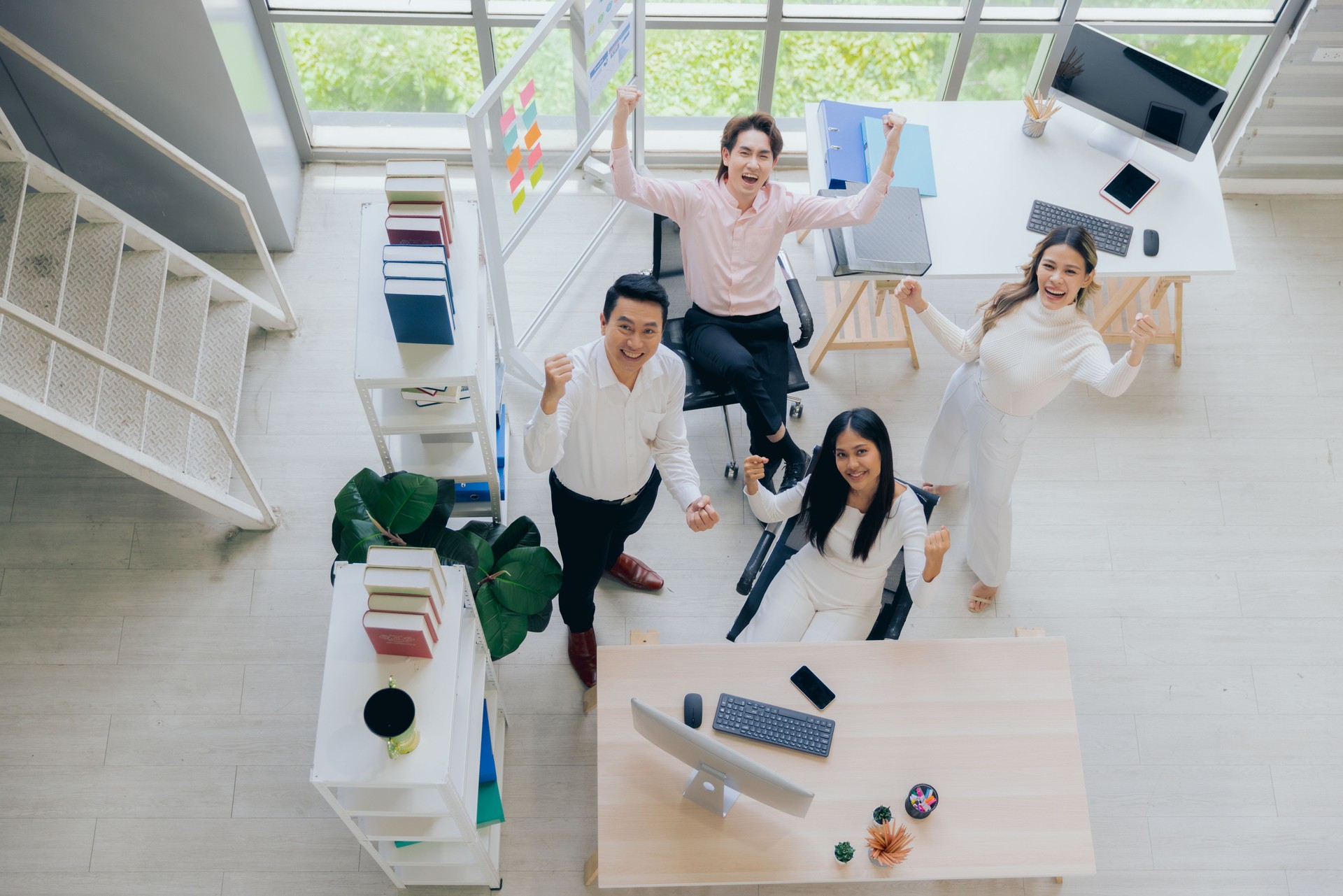 Young colleagues male and female group coworker in casual working at workspace office, Back to the office concept, Top view